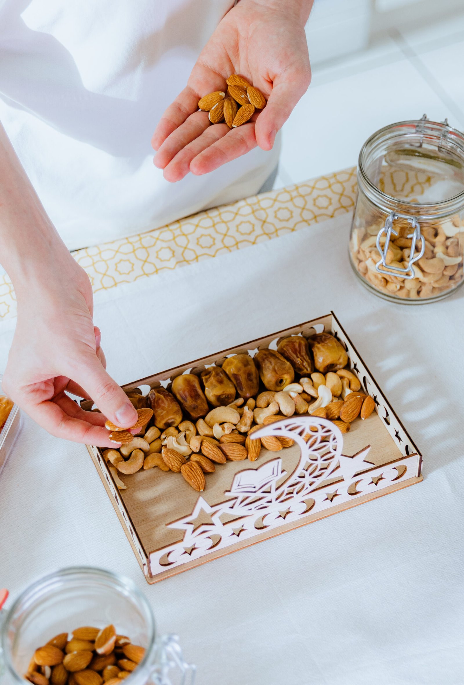 hands arranging gourmet gift box